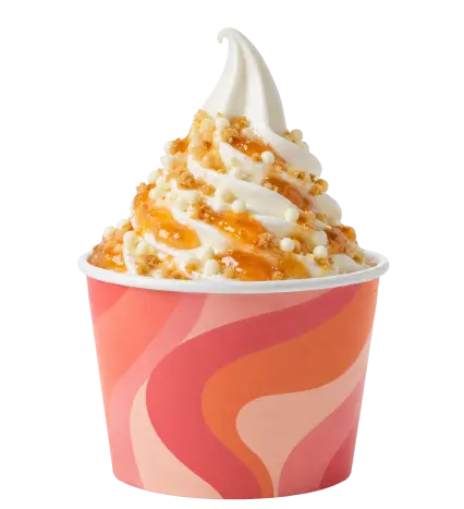 Yogurt gelato con salsa al mango e topping croccanti
